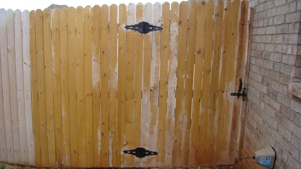 a fence stained by an amateur