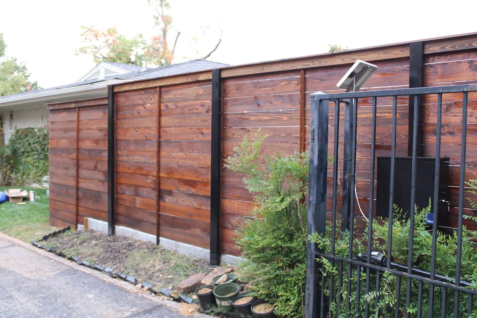 Horizontal wood fence stained in Edmond, OK
