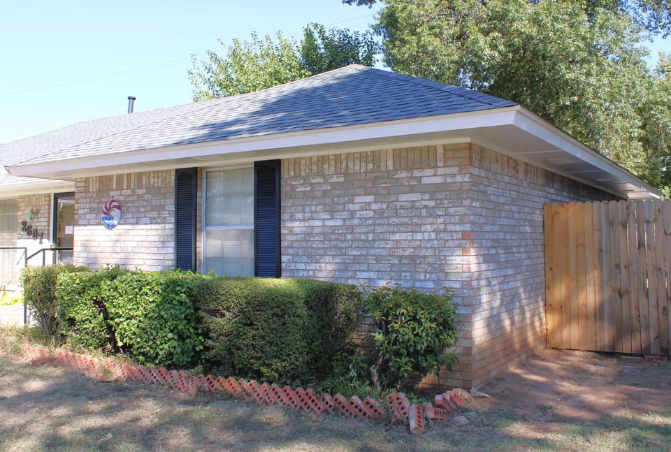 A brick home in Bethany, OK with newly painted shutters