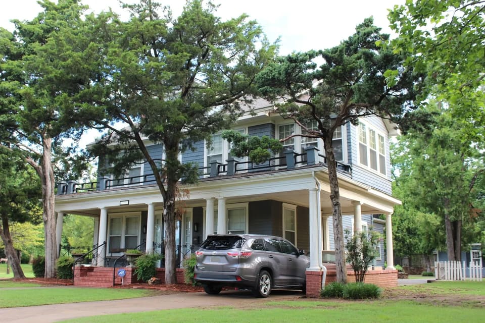 exterior of a house in okc painted blue and white color