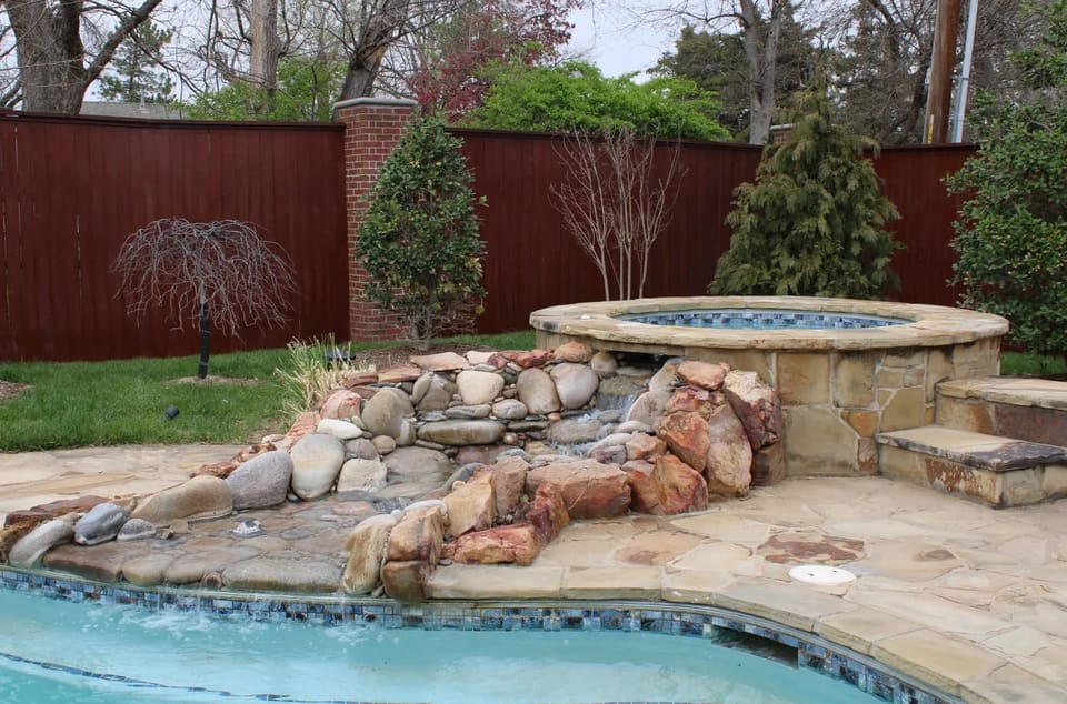A cedar wood fence stained with oil-based stain in OKC