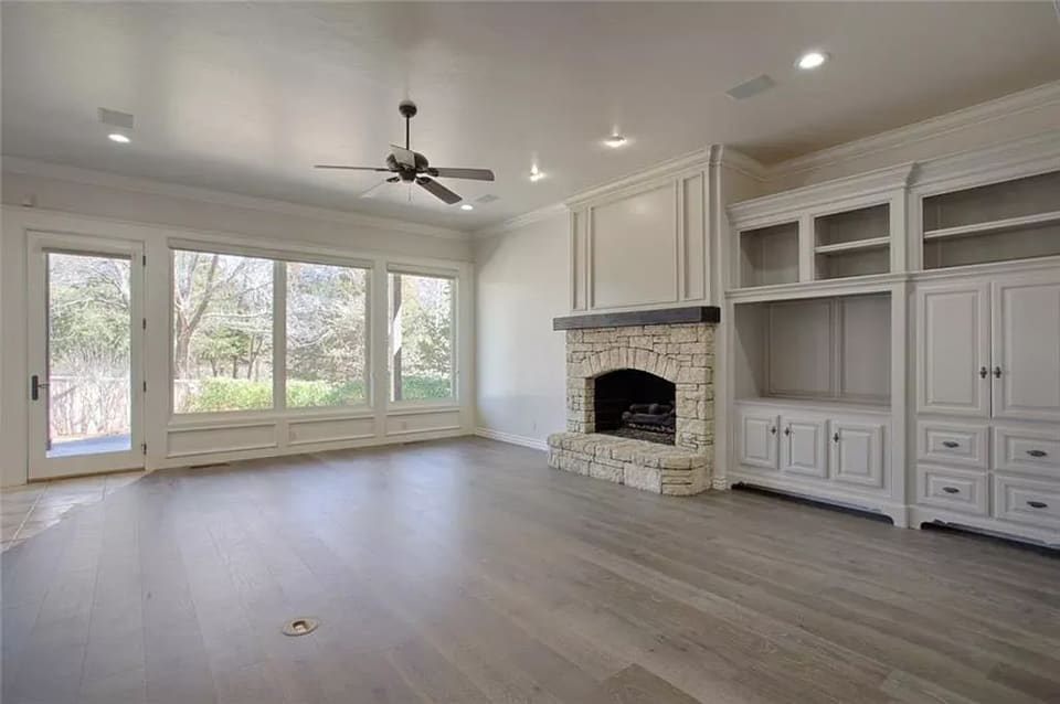 Built-in cabinetry and mantel painted cream in an Edmond, OK living room