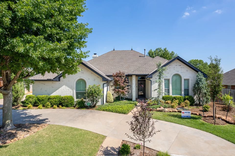 Painted white brick ranch home on Timberdale Drive in Edmond, OK