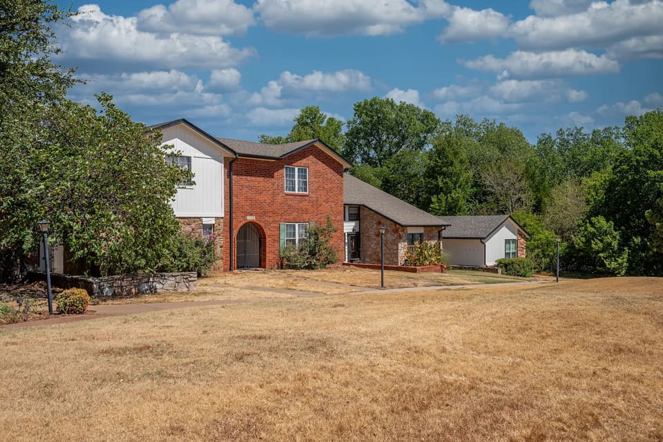 Two-story townhome building at The Crossing in Edmond after an HOA repaint by Hometown Painting